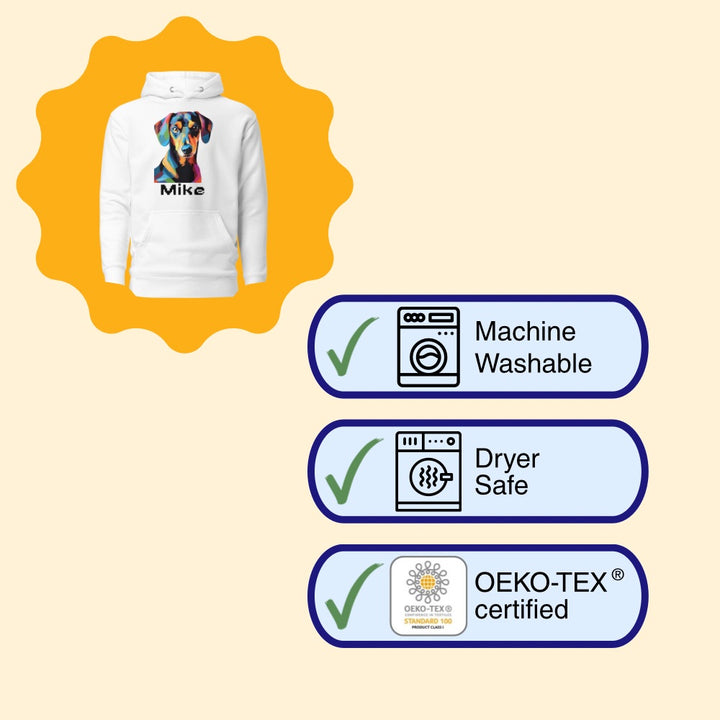 White hoodie with a colorful dog design and washing instructions on a beige background