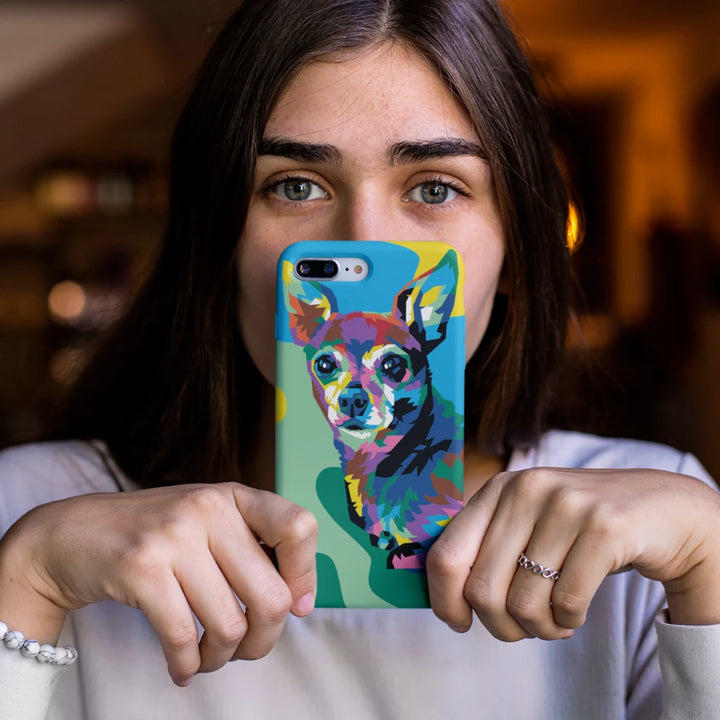 Person holding a phone with a colorful dog design case