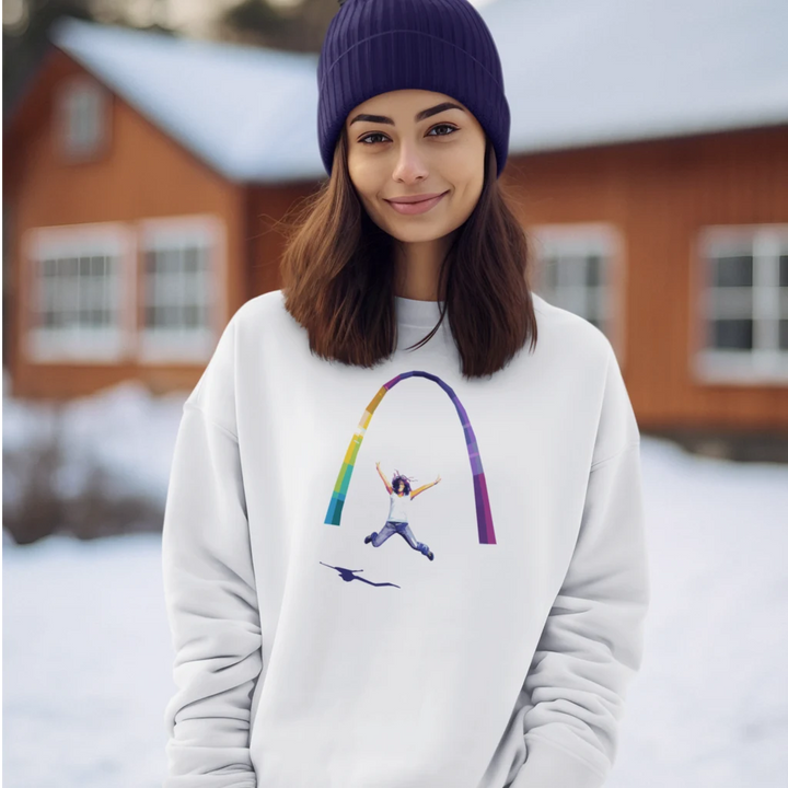 Person wearing a white sweatshirt with a colorful design in a snowy outdoor setting